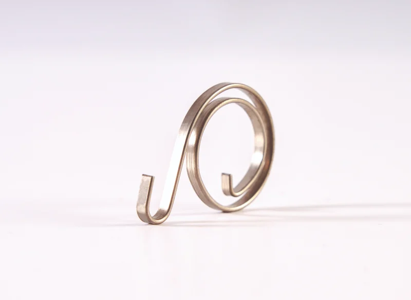 Conformado de fleje metálico en forma de espiral utilizado como componente elástico o de sujeción.